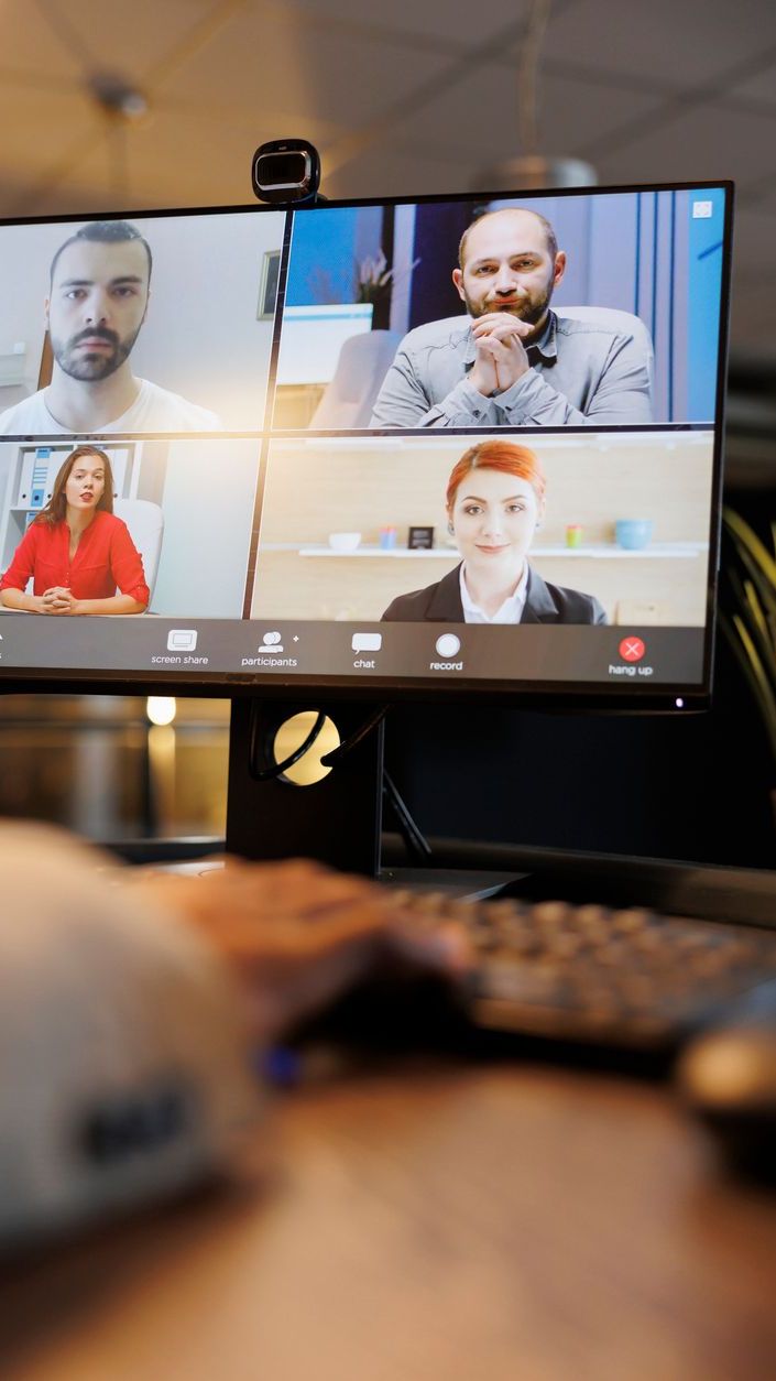 Manager explaining company investment strategy to remote colleagues virtual focus group facilitation participants